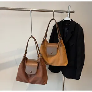 Detail view of large capacity matte hobo tote bags with shoulder chains and buckles