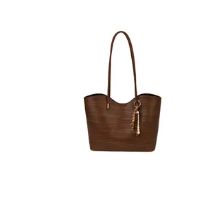 Minimalist dark brown woven tote bag with shoulder strap and decorative colorful wood beads