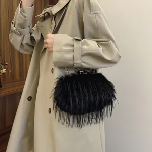 Elegant black faux fur shoulder bag with gold chain strap and metal lock closure