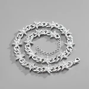 Detail of silver Cuban chain necklace with sparkling rhinestone stars and lobster clasp