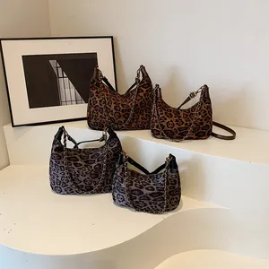 Leopard print underarm bags in brown and grey colors with stylish chain straps