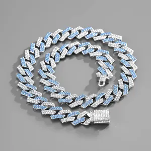 Detail of silver Cuban chain necklace with blue and white rhinestones and pave lock