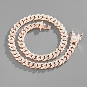Detailed macro view of 19mm rose gold Cuban link necklace with pavé-set rhinestones