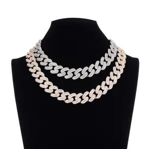 Macro detail of 19mm Cuban link chains with iced out rhinestones in silver and rose gold