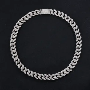 Macro detail of 15mm silver iced out Cuban link chain with sparkling rhinestones and buckle