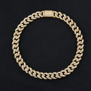 Detail of 15mm gold Cuban link chain with encrusted rhinestones and secure clasp