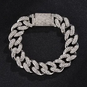 Macro shot of 15mm silver Cuban link necklace with sparkling crystals and buckle detail