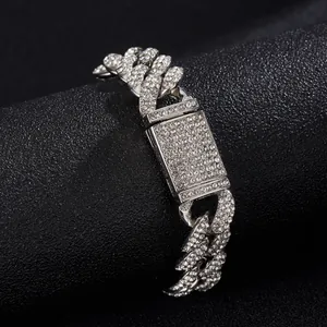 Close-up of 15mm silver plated Cuban link bracelet with iced out crystals and fold-over clasp