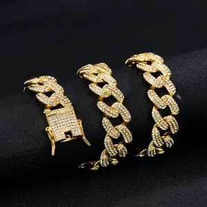 Detailed macro view of 19mm gold Cuban link chain with icy rhinestones and a secure box clasp