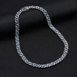 Hip hop Cuban link chain necklace with alternating blue and white crystals on black background