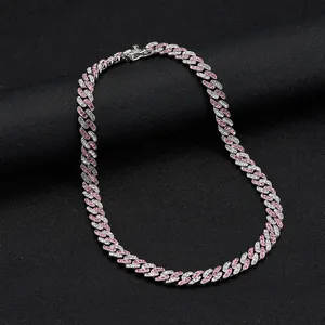 Hip hop Cuban link chain necklace with alternating pink and white rhinestones on black stand