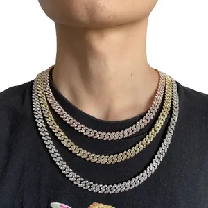 Three Cuban link necklaces in gold silver and rose gold with iced out crystals on model