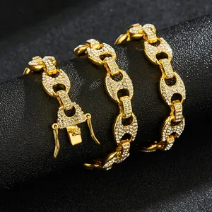 Detail of gold-plated coffee bean link bracelet with white pavé rhinestones