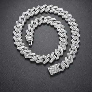 Macro shot of silver-plated Cuban link chain with sparkling white rhinestones and a secure clasp