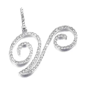 Macro view of silver-colored spiral pendant with micro-pave crystals and polished finish