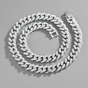Macro detail of silver-toned hip hop cuban link chain set with sparkling zircon stones
