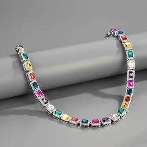 Macro shot of silver tennis necklace with colorful rectangular crystals and micro-pave diamonds