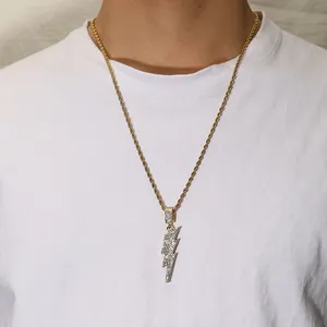 Luxurious gold twisted rope chain necklace with a sparkling iced-out lightning bolt pendant