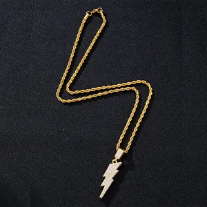 Iced out gold lightning bolt pendant on rope chain necklace with sparkling crystals