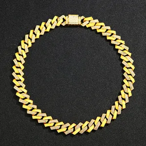 Detail of 15mm gold Cuban link chain featuring micro-pave rhinestones and square clasp