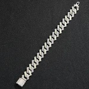 Close-up of 15mm silver Cuban link chain featuring luminous green panels and crystals