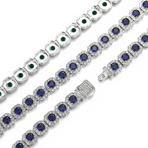 Detail of hip hop Cuban chain with blue sapphire center stones and iced out box clasp