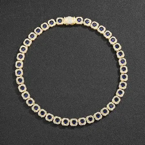 Luxury gold plated cuban link necklace with royal blue stones and diamond halo on black leather