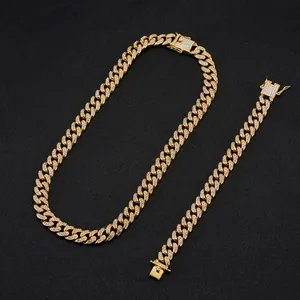 Close-up of gold iced-out Miami Cuban link chain necklace and bracelet jewelry set