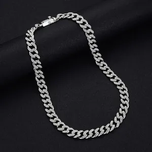 Macro detail of silver Miami Cuban link chain necklace with cubic zirconia pave setting