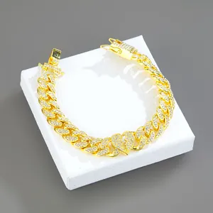 Iced out gold Cuban link bracelet with a sparkling broken heart pendant for hip hop style