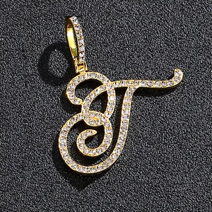 Iced out gold cursive letter T pendant with pavé set crystals for hip-hop style
