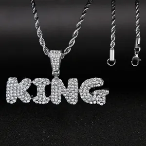 Silver tone KING letter pendant necklace with sparkling pavé crystals and rope chain