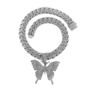Iced out hip hop Cuban link necklace featuring a large silver butterfly pendant with crystals