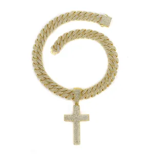 Iced-out Cuban link chain necklace with a matching diamond cross pendant in gold finish