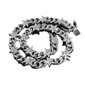 Collana a catena cubana argentata con ciondoli a stella e intarsio di zirconi brillanti