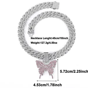 Macro view of iced out Cuban link chain with a pink butterfly pendant and 45cm measurements