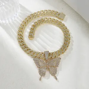 Chunky gold butterfly pendant necklace set with hip hop iced out Cuban chain detail