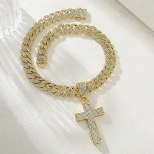 Macro detail of iced-out gold Cuban chain and cross pendant with micro pave zircon stones