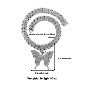 Detail view of large butterfly pendant with iced-out crystals and cuban chain dimensions