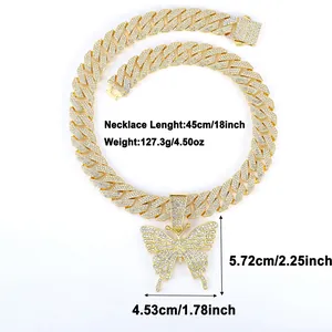 Detailed view of heavy gold Cuban link chain with large iced-out butterfly pendant size specs
