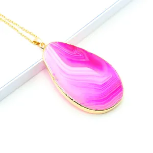 Natural pink agate teardrop pendant with gold-plated edges on a delicate gold chain