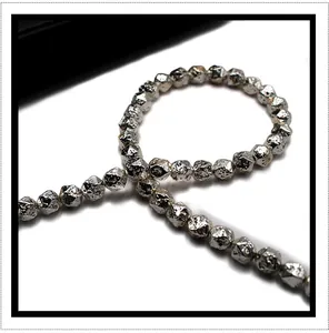 Macro shot of silver plated lava stone beads with faceted texture for DIY jewelry making
