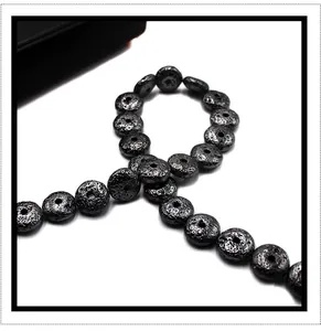 Detailed view of porous black lava stone beads with natural texture for DIY jewelry