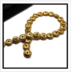 Macro shot of gold plated volcanic lava rock spacer beads for DIY jewelry making