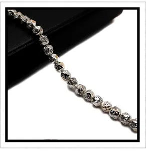 Macro detail of faceted silver electroplated volcanic stone beads for DIY jewelry