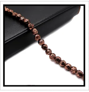 Macro detail of faceted bronze volcanic rock beads for DIY bracelet jewelry making