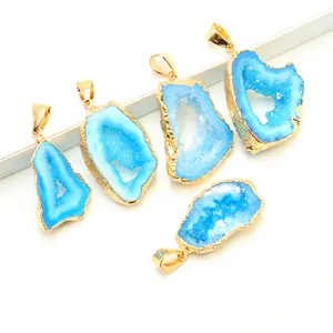 Five pieces of irregular blue agate geode pendants with gold plated edges and large bails