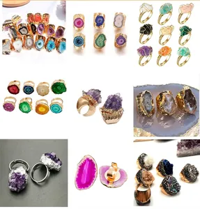 Macro shot of natural agate and amethyst crystal stone rings in gold settings