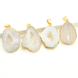 Set of four unique natural agate druzy slice pendants with gold plated edges on white stand