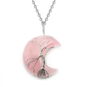 Collana con ciondolo a luna in cristallo rosa e albero della vita in filo d'argento